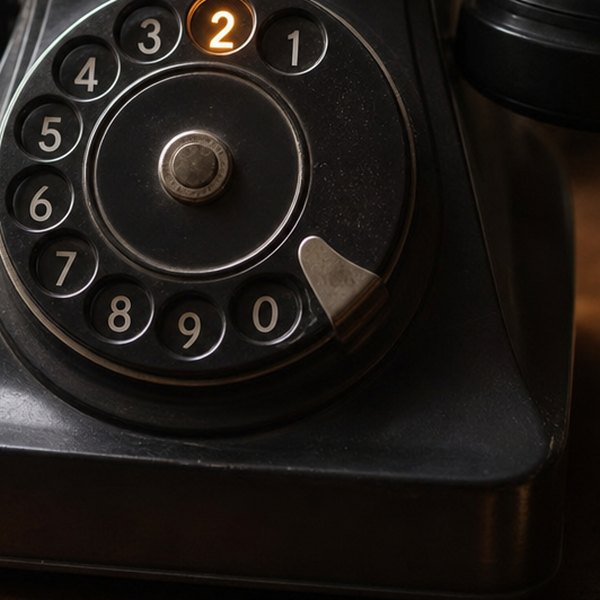 Vintage rotary telephone with digit two highlighted — detail