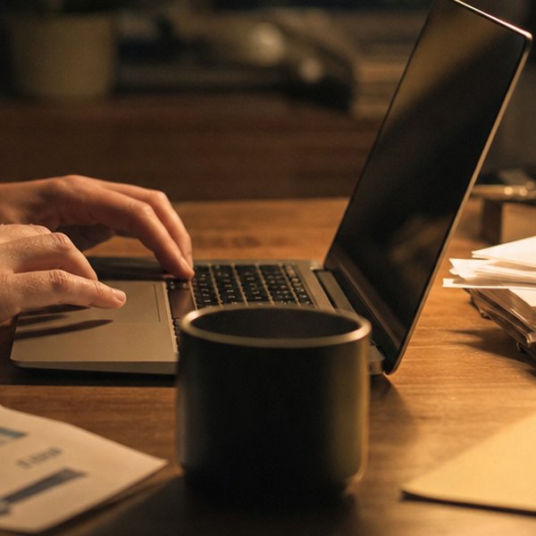 Person working multiple jobs simultaneously overwhelmed — detail