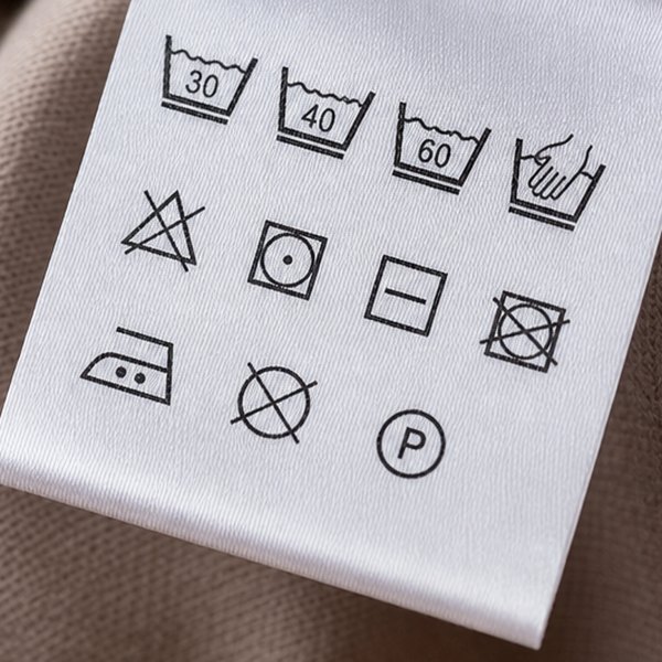 Small instruction label sewn into fabric — detail